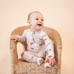 Baby wearing Bamboo Convertible romper oatmeal cow