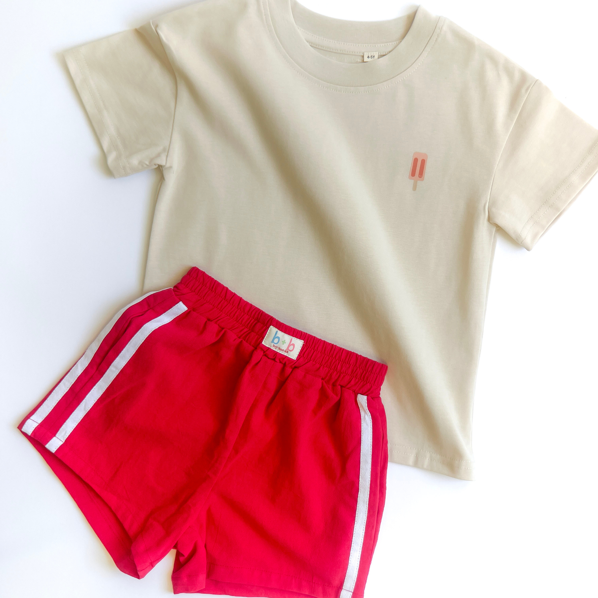 Popsicles tee paired with red Firecracker racer shorts — mix-and-match Golden Days outfit for kids