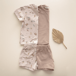 Flat lay of bug + bean kids organic cotton toddler short sets in Summer Vibes print and solid mocha, designed for comfort and mix-and-match style
